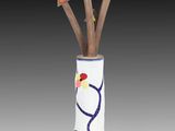 a vase that has a bunch of sticks sticking out of it