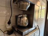 a coffee maker sitting on a counter in a kitchen