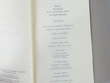 someone is holding a book open to a page with a list of items in it