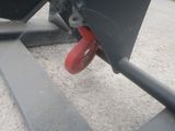 a close up of a red wheel on a black boat