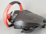 a black and red steering wheel with a red handle