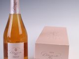 a bottle of wine next to a box of wine