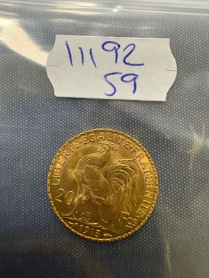a close up of a gold coin in a plastic bag