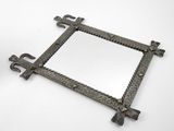 an image of a square mirror with a cross design on it