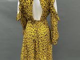 a yellow and black leopard print dress on a mannequin mannequin mannequin mannequin mannequin mannequin mannequin manne