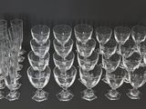 a lot of empty wine glasses on the table