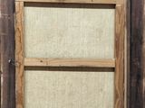 an old picture of a window with a wooden frame on the outside