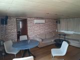 a living room with a couch, table, and chairs in it