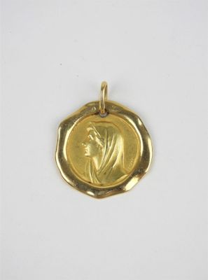l'image d'une pièce d'or sur laquelle figure une femme