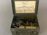 a metal box with a bunch of items inside of it