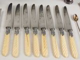 five knives that are sitting next to each other on a table