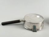 a silver pot and a silver pan on a white table