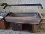 a buffet table with a sink and a counter with a counter top