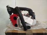a chainsaw sitting on top of a box with a price tag on it