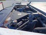 an image of a truck with its engine in the back of it ' s bed