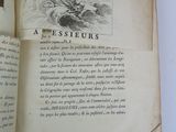 an open book with a picture of a man on it