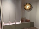 an image of a room with a bench and a clock on the wall