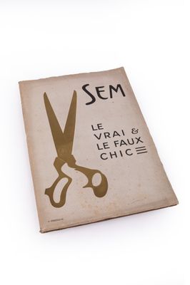 un livre sur lequel figure l'image d'une paire de ciseaux