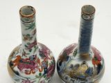 two vases that are sitting on a white surface
