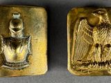 deux pièces d'or sur lesquelles figurent un aigle et un oiseau