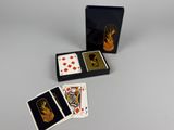 two decks of playing cards and a box of playing cards on a table