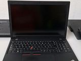 two laptops that are sitting on a table
