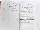 someone is holding a book open to a page that has writing on it