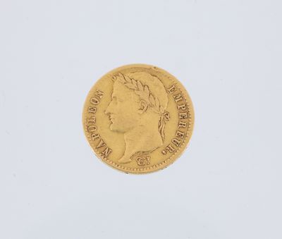 a gold coin with a woman ' s head on it