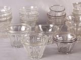 a lot of glasses that are sitting on a table