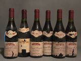 plusieurs bouteilles de vin sont alignées sur une table