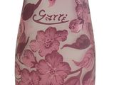 purple and white vase with pink flowers and name on it