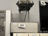 a television on top of a stove in a store