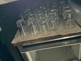 a machine that has a lot of empty glasses on it