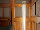 a lamp that is sitting on a table in a room