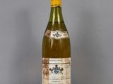 a bottle of wine that is sitting on a table