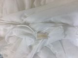 a close up of a white pillow with a label on it