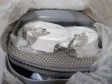 two rolls of toilet paper in a plastic container