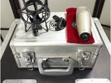 a silver case with a microphone and a microphone on top of it