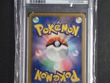 a close up of a pokemon card in a plastic case
