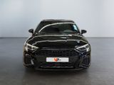 the front of a black audi rs4 sedan parked in a showroom