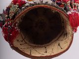 a close up of a hat with flowers on it