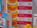 many different types of toothpaste on the counter