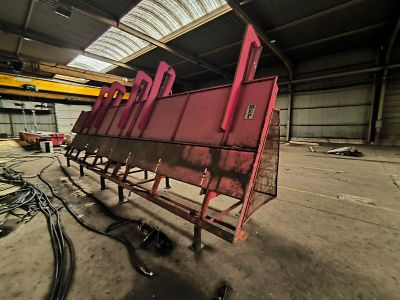an image of a large red machine in a warehouse