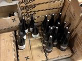 many bottles of wine in a box on the floor