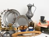 a lot of silver and gold items on a table