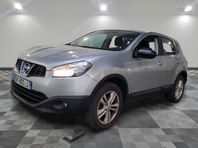 the silver nissan qx is parked in a room with a checkered floor