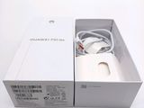 a white box with a charger inside of it on a white surface