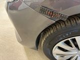a close up of a car ' s tire with a measuring tape on it