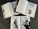 three open books on a table with a drawing of a man in a hat and a drawing of a man in a hat