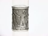 a silver vase with a picture of a woman on it